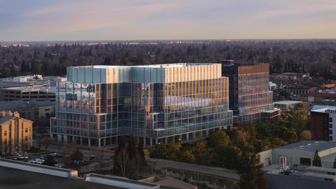 A large building in Sacramento on the UC Davis campus with many glass windows called Aggie Square