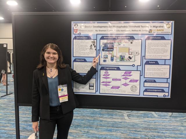 Shannon Lamb in front of her poster session