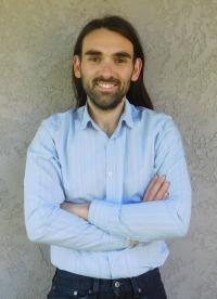 gerard ariño-estrada posing in front of a wall